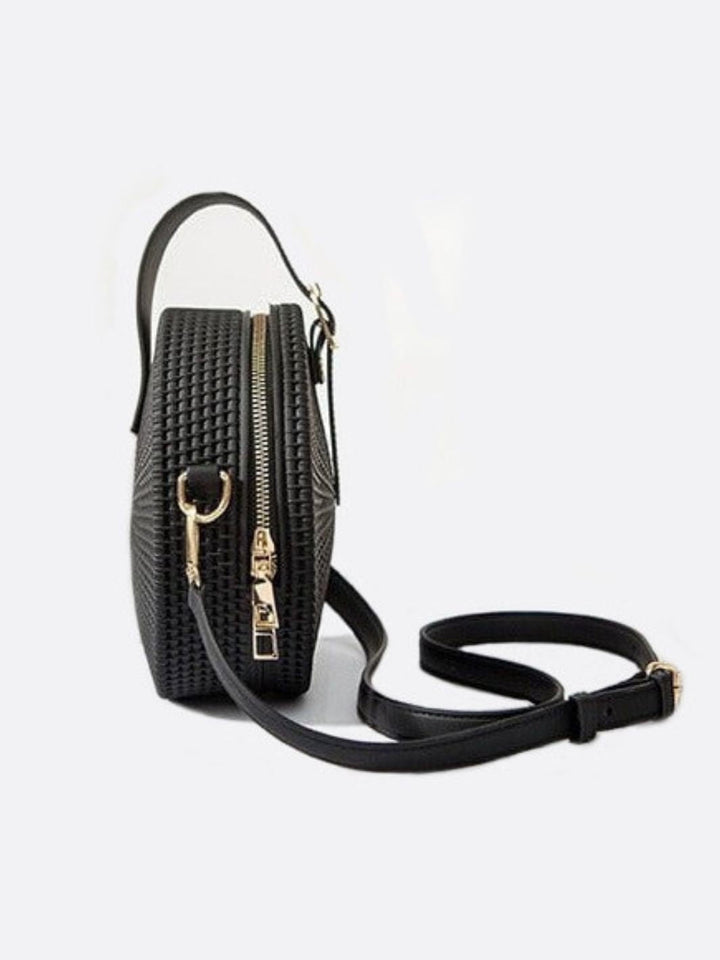 Bolso redondo de piel 