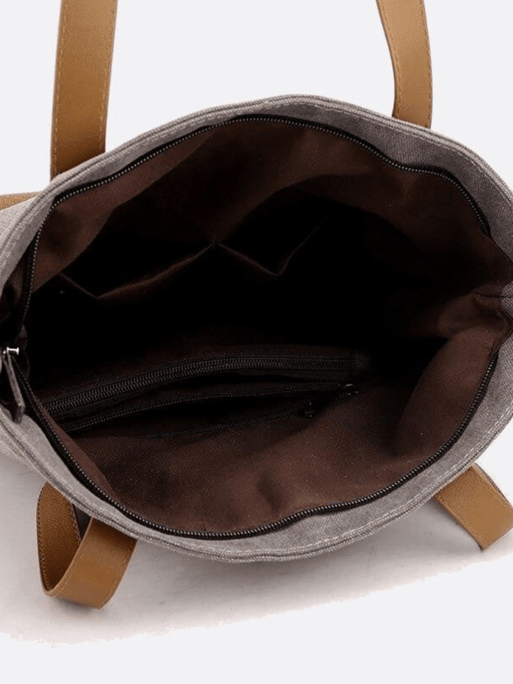 Bolso de lona para llevar al hombro y a la espalda.